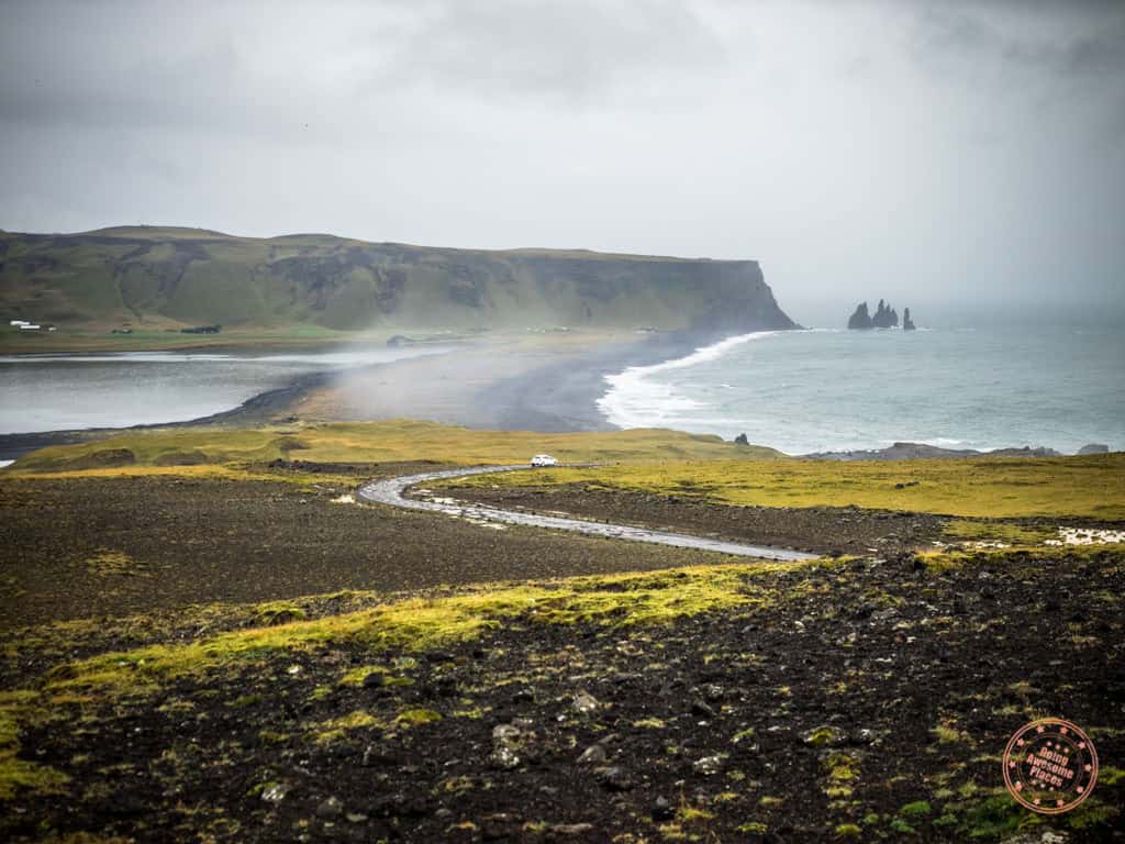 iceland road trip in dyroholaey with car on the road