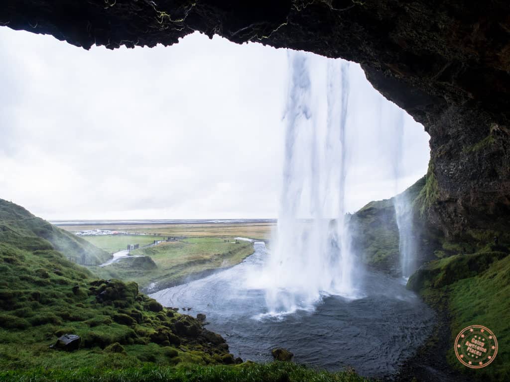 view of seljialandfoss waterfall from behind the curtain