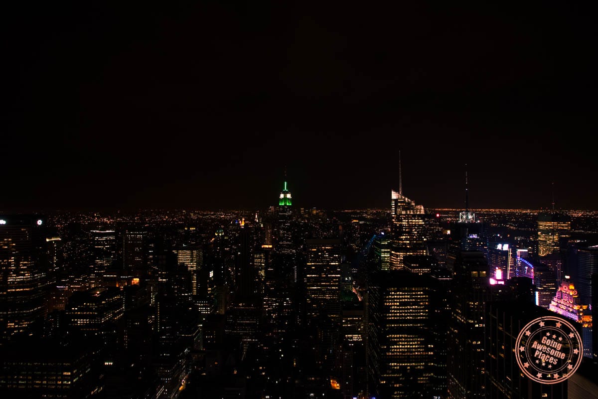 view over new york buildings lit up at night