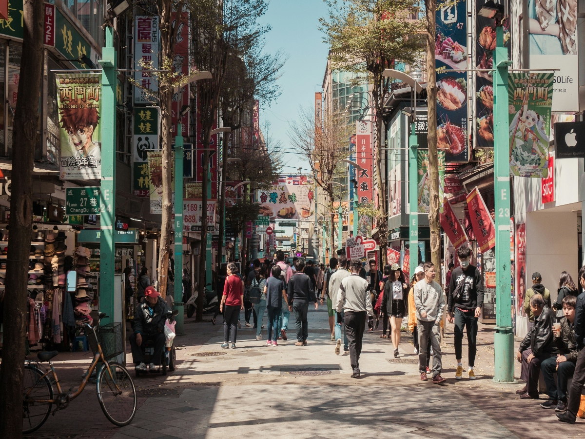 tourists exploring busy street of ximending night market