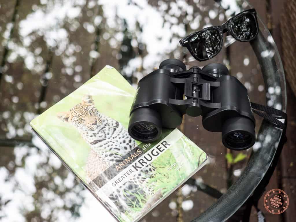 binoculars and kruger animal guide book at elephant plains