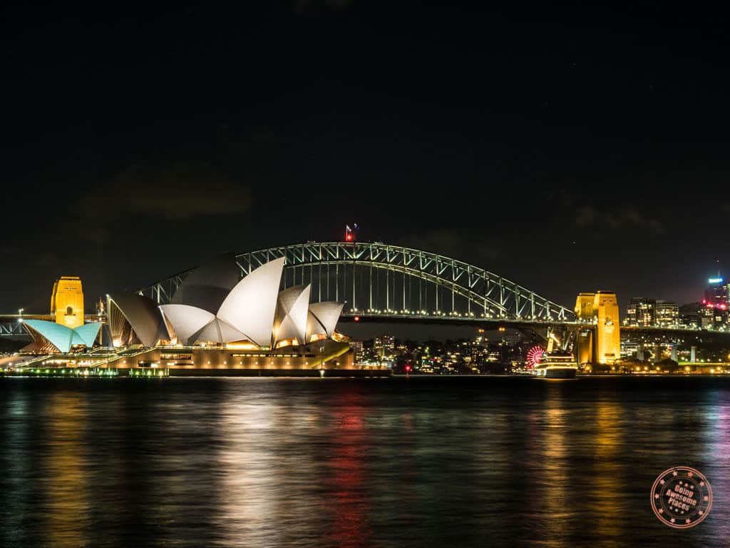 sydney opera house and harbour bridge at night