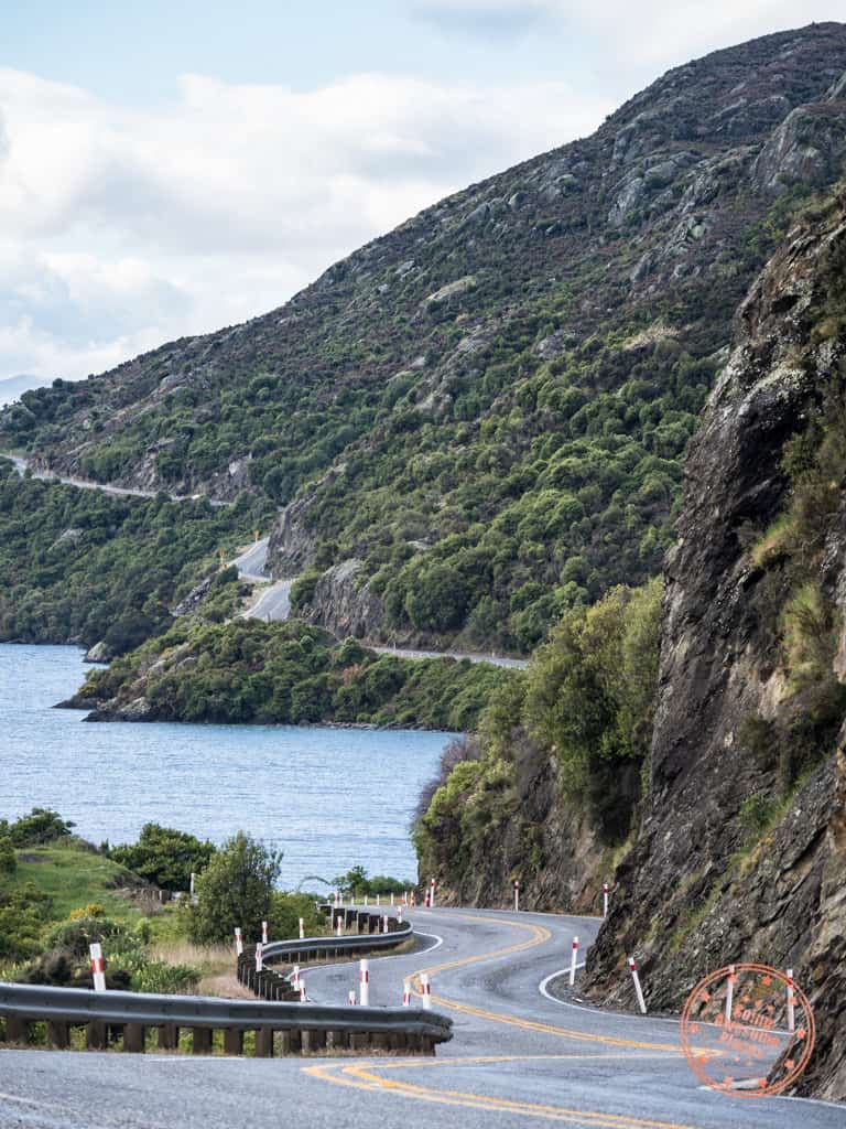 winding road on road towards te anau in south island new zealand