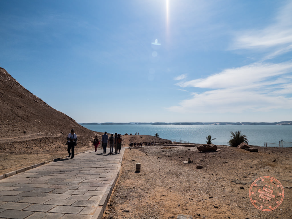 walking in to see abu simbel with lake nasser behind