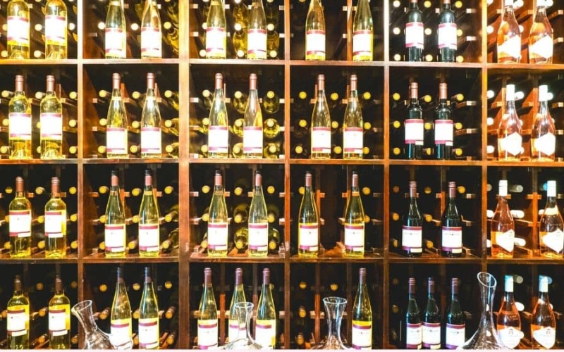 wall of wine bottles in niagara falls wine tours