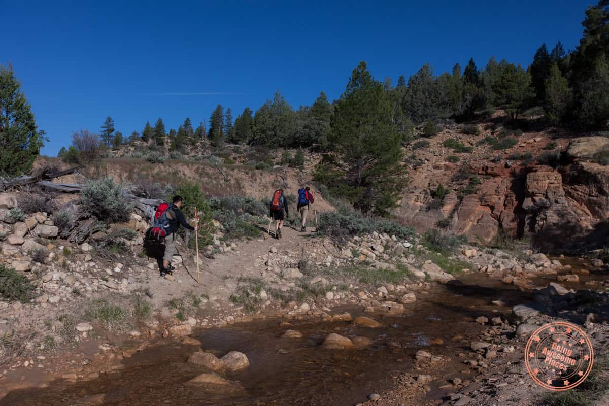 3 guys at the start of hiking the narrows in zion national park