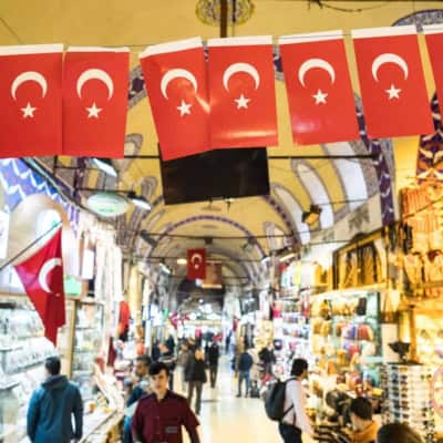 grand bazaar with a row of small flags of turkey in focus