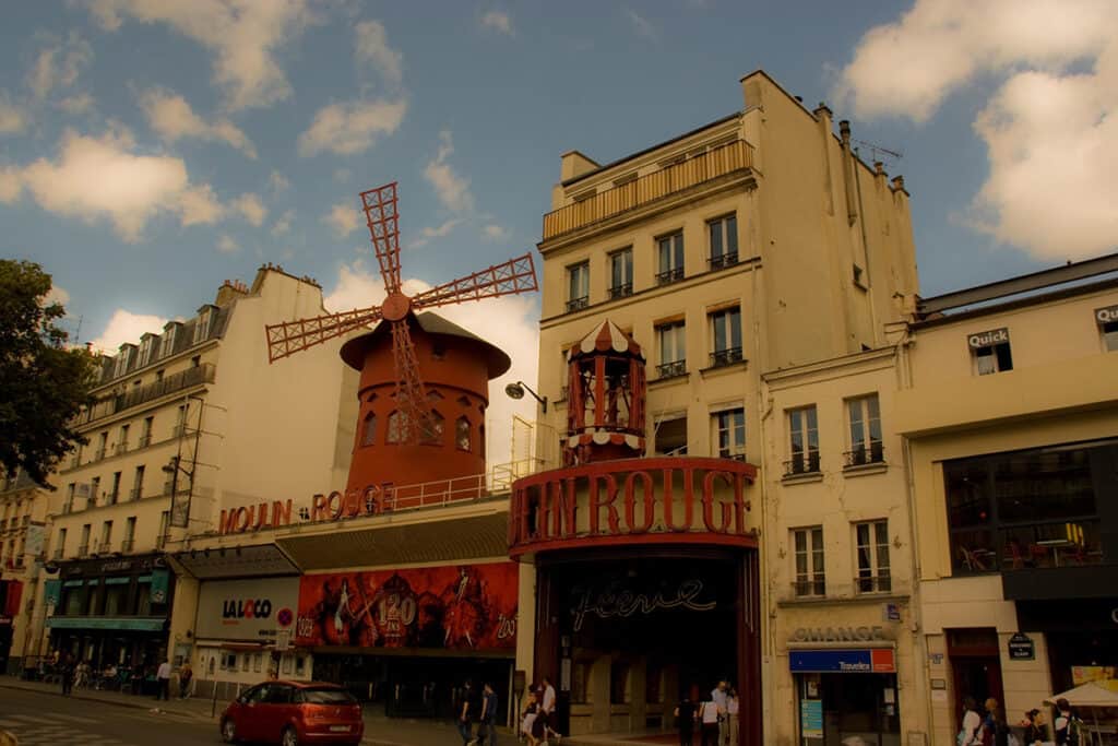 moulin rouge and iconic windmills in the montmartre neighbourhood of paris