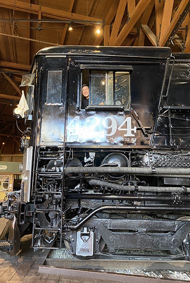 california state railroad museum posing with a giant locomotive