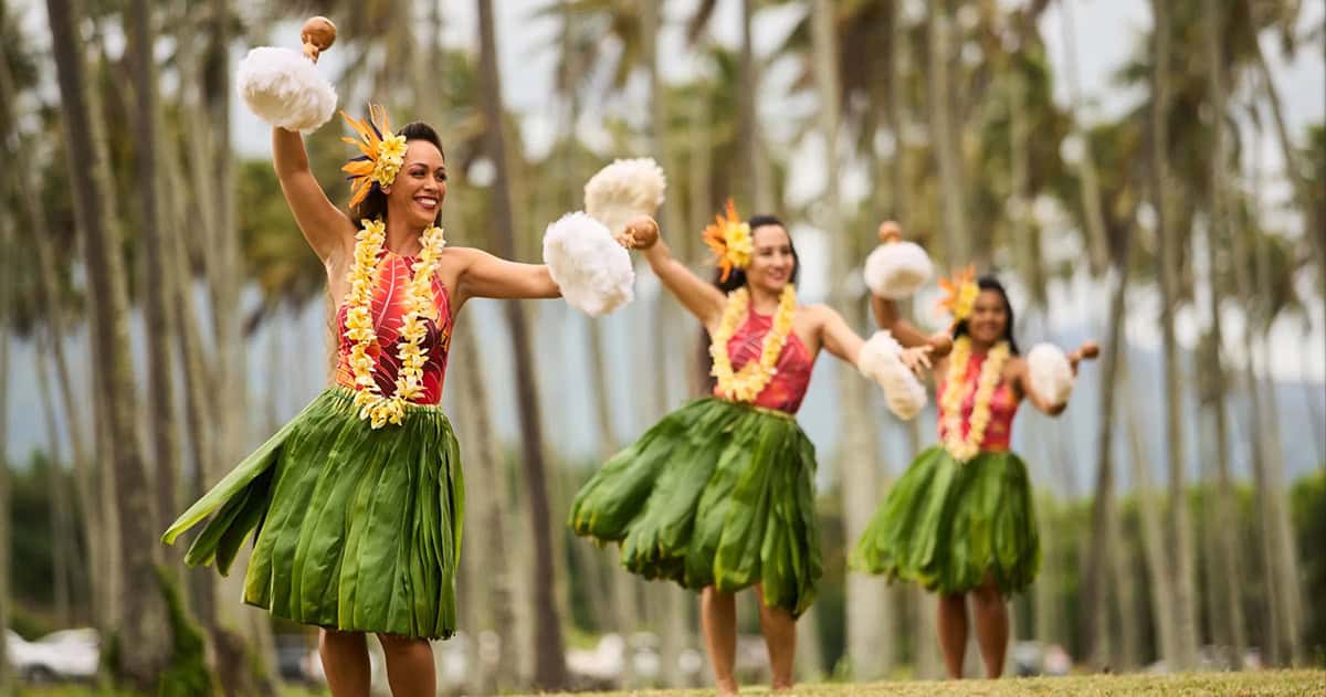 3 hula dancers from the luau ka hikina at the sheraton coconut beach resort