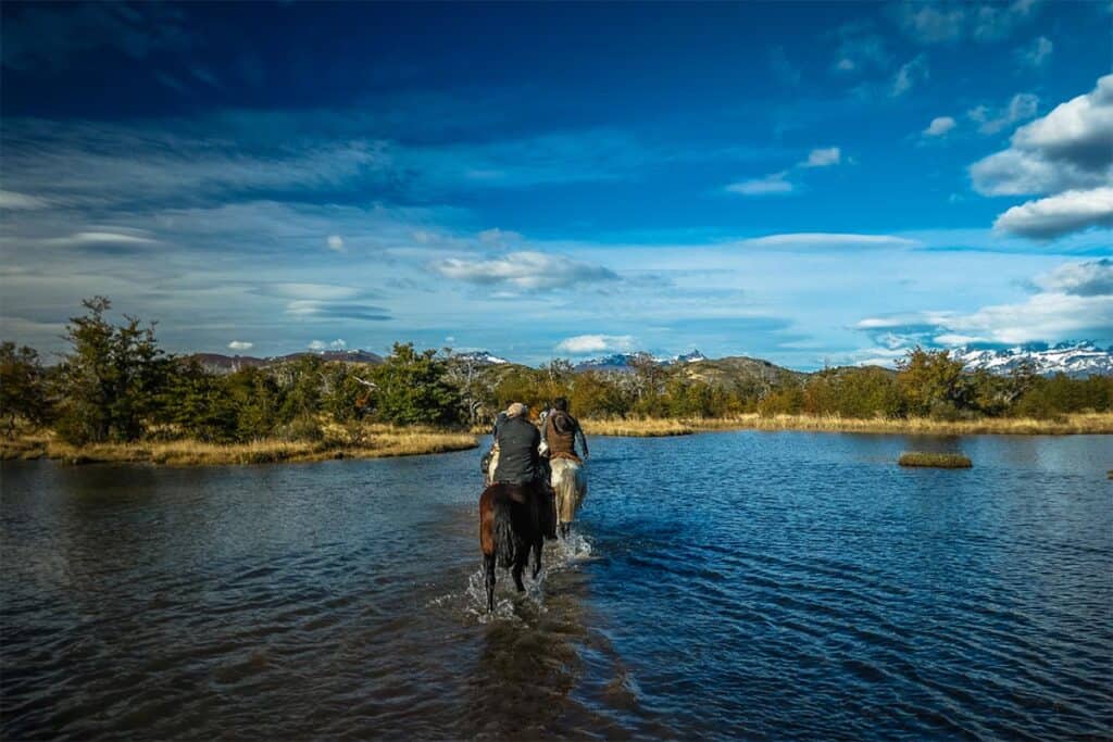 horseback riding along serrano river on second day of patagonia itinerary with chile nativo