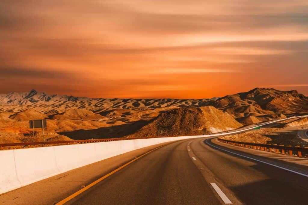 Driving out of Las Vegas looking into the mountains at sunset