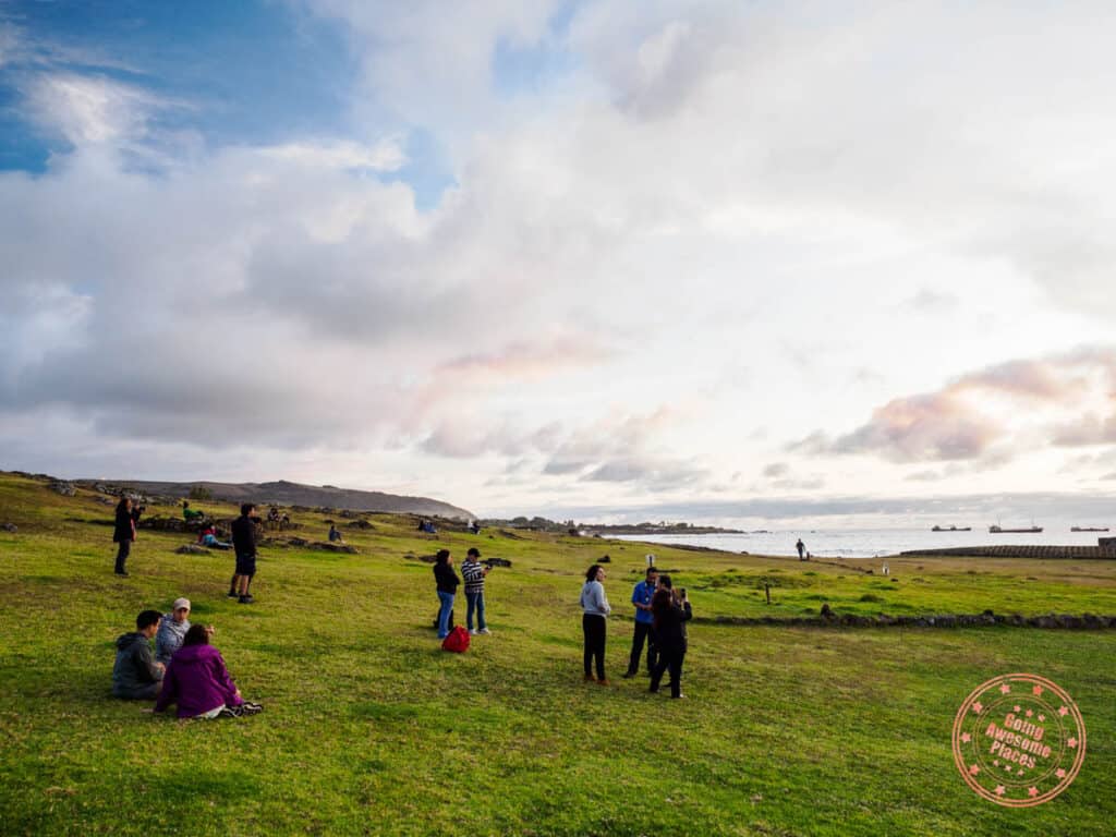 crowd watching the sunset at tahai on easter island