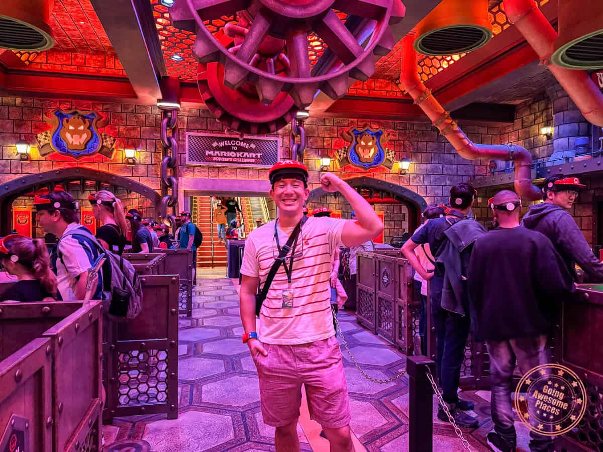 asian guy excited for super nintendo world mario kart bowser's challenge ride