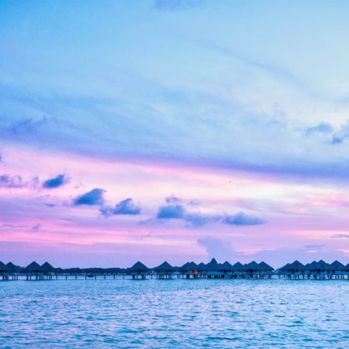 best beaches tahiti bungalows at sunset