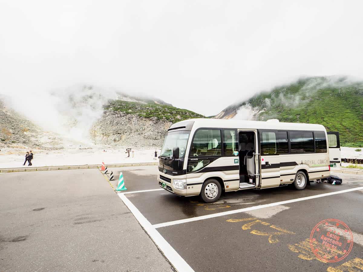 adventure hokkaido tour bus parked at mt io