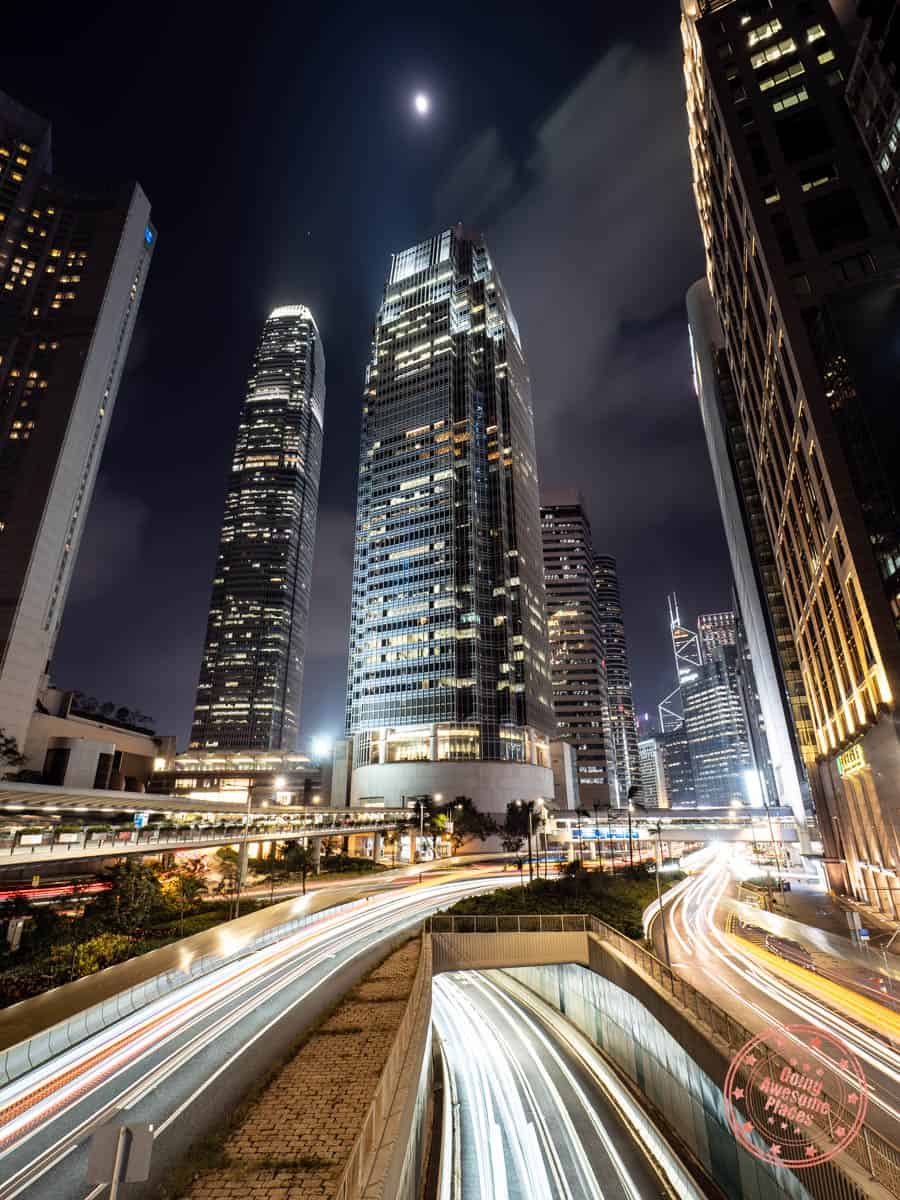hong kong long exposure photography with streaks of car lights and skyscrapers such a IFC and Bank of China