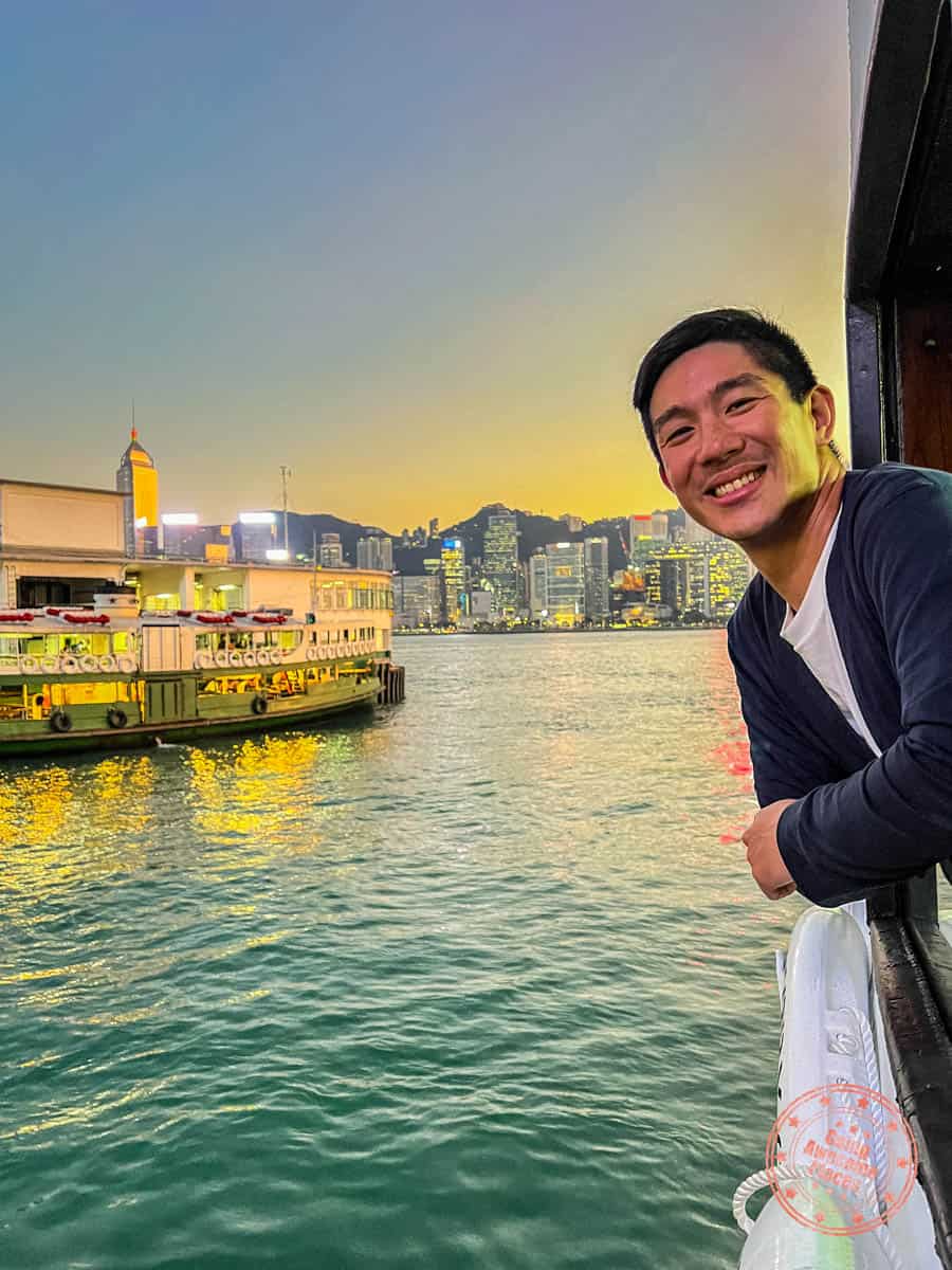 man enjoying view from second deck of the star ferry in hong kong