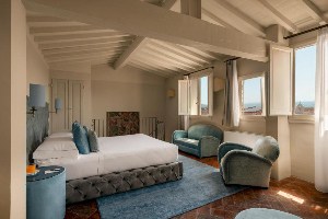 loggiato dei serviti large suite with wood beam ceiling