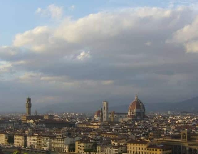 view of florence skyline from afar beneath cloudy sky