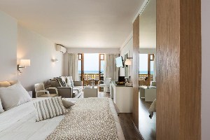 best places to stay in crete ammos suites room with living space and ocean view balcony