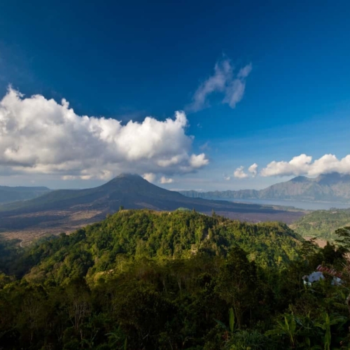 view overlooking mount batur under blue skies with clouds