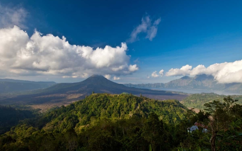 view overlooking mount batur under blue skies with clouds