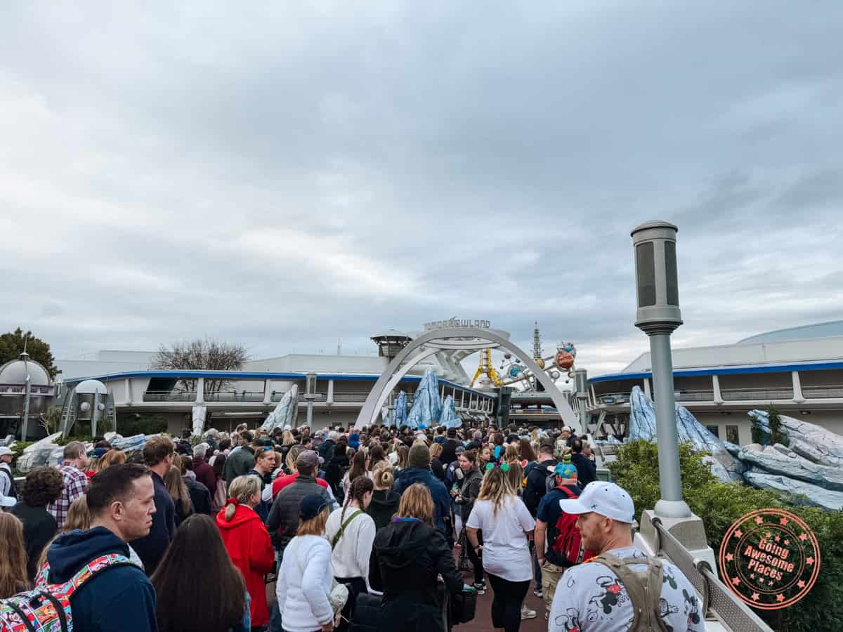 early entry rope drop on bridge towards tomorrowland at magic kingdom