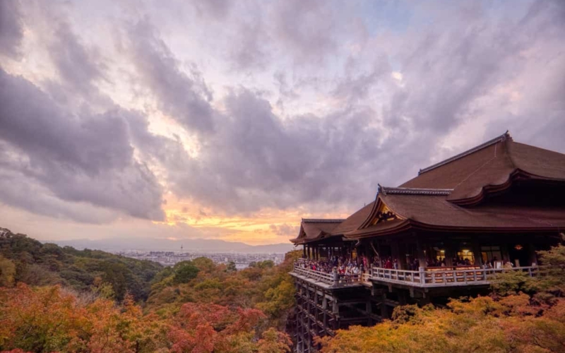 view of kiyomizu-dera within the trees during the fall