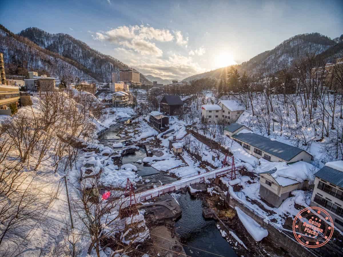 aerial view of snow covered town of jozankei in minami