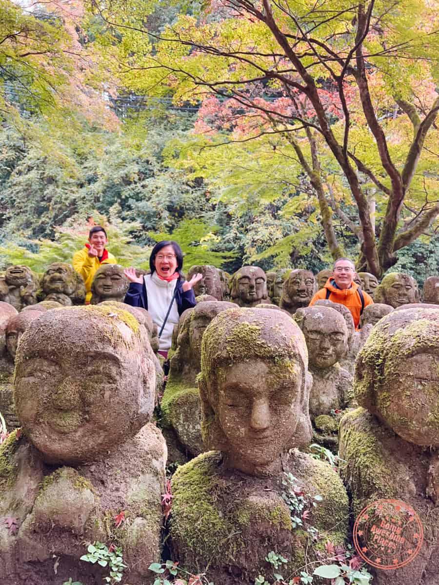 10 Day Japan Itinerary For First Timers - Modern Golden Route family photo with small statues at otagi nenbutsuji temple