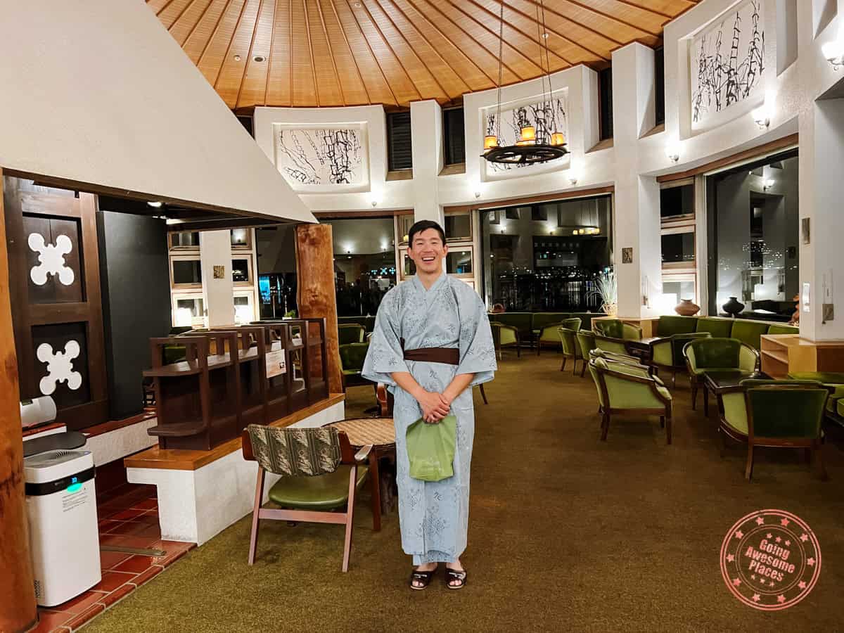10 Day Japan Itinerary For First Timers - Modern Golden Route man at fuji lake hotel wearing a yukata for onsen session