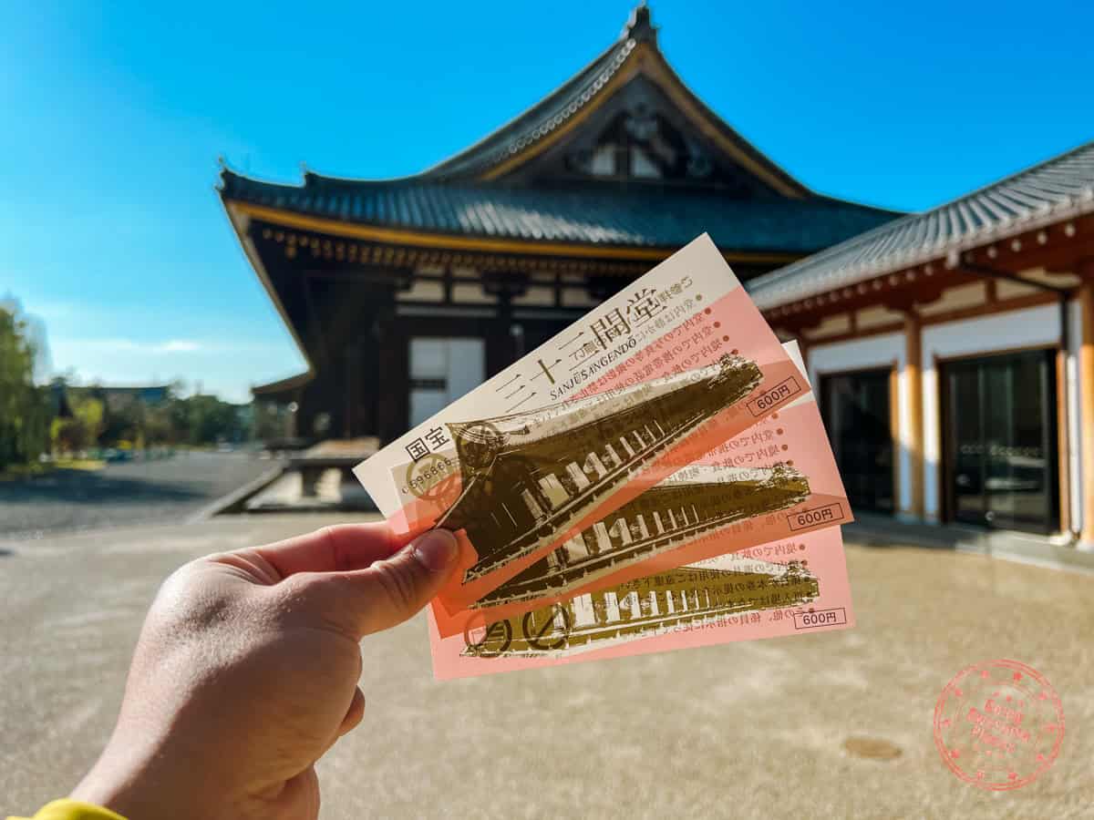 10 Day Japan Itinerary For First Timers - Modern Golden Route sanjusangendo temple holding three entrance tickets