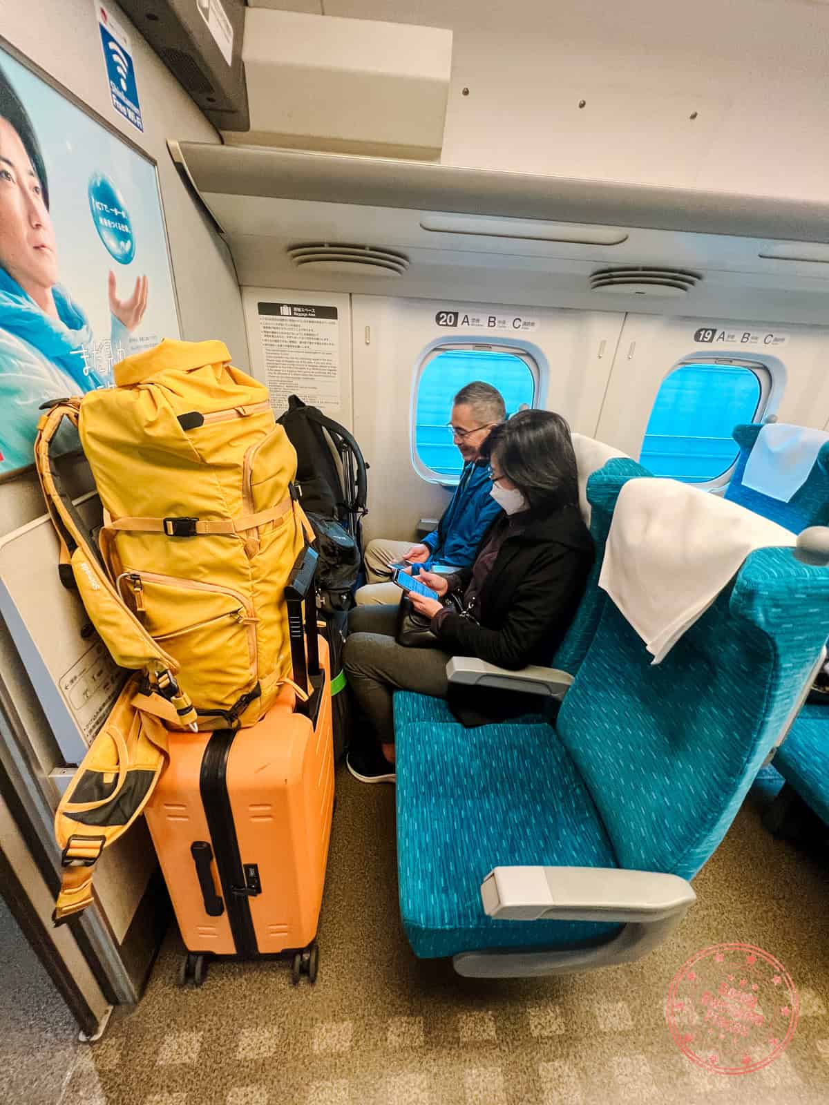 10 Day Japan Itinerary For First Timers - Modern Golden Route storing luggage on japan on first row while taking train from osaka to kyoto