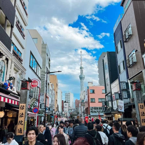 skytree in the background of a busy tokyo street