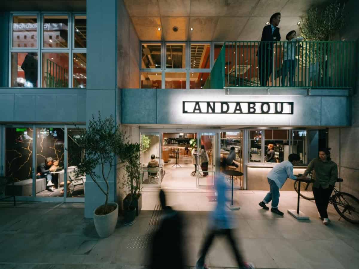 people walking by the landabout tokyo entrance