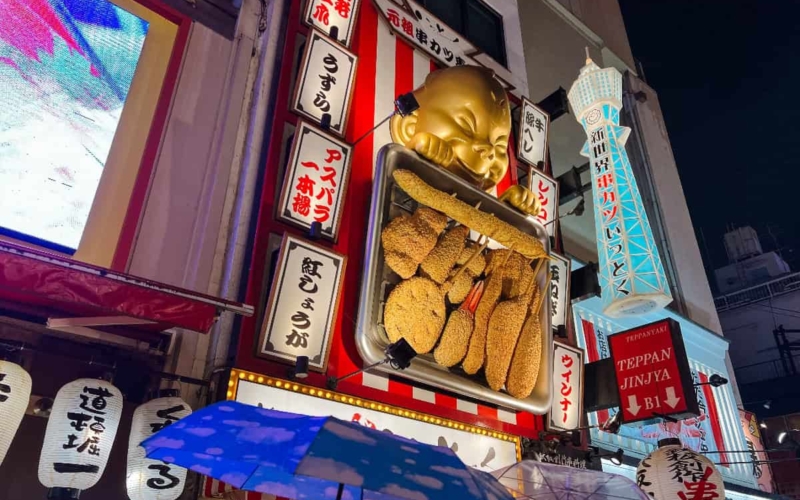 sign above restaurant in osaka