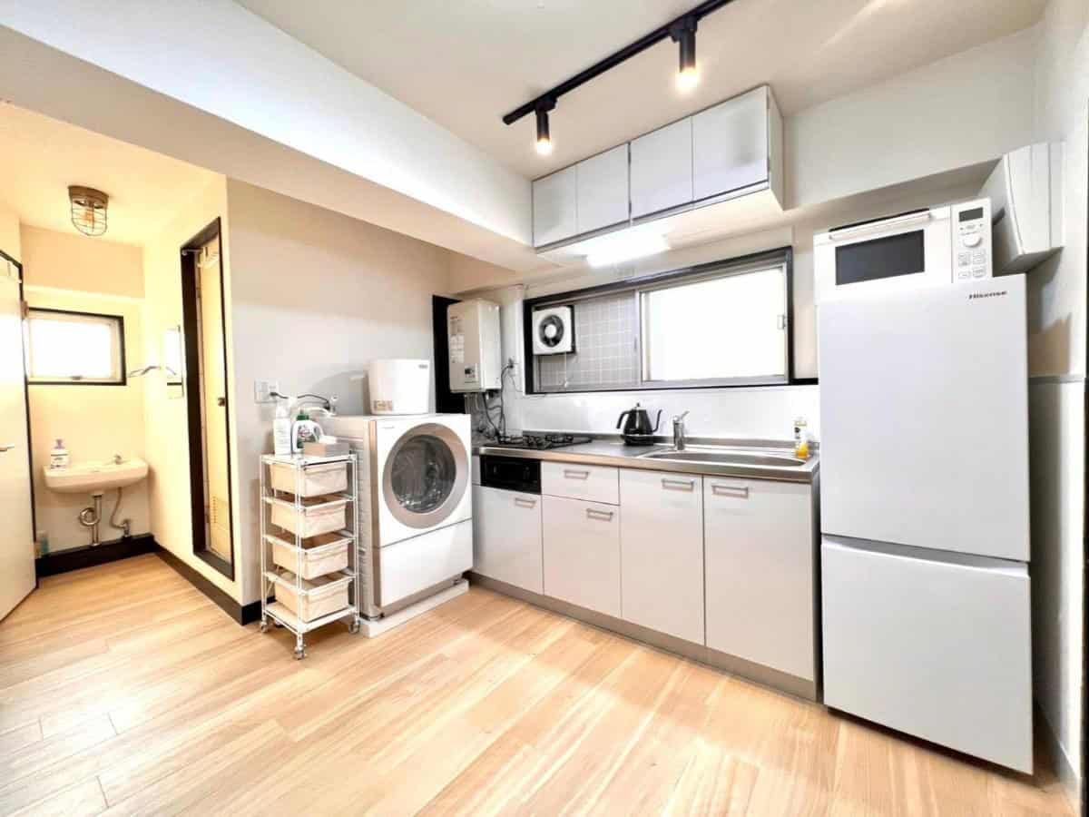 kitchen and bathroom area in apartment at ueno retro flower