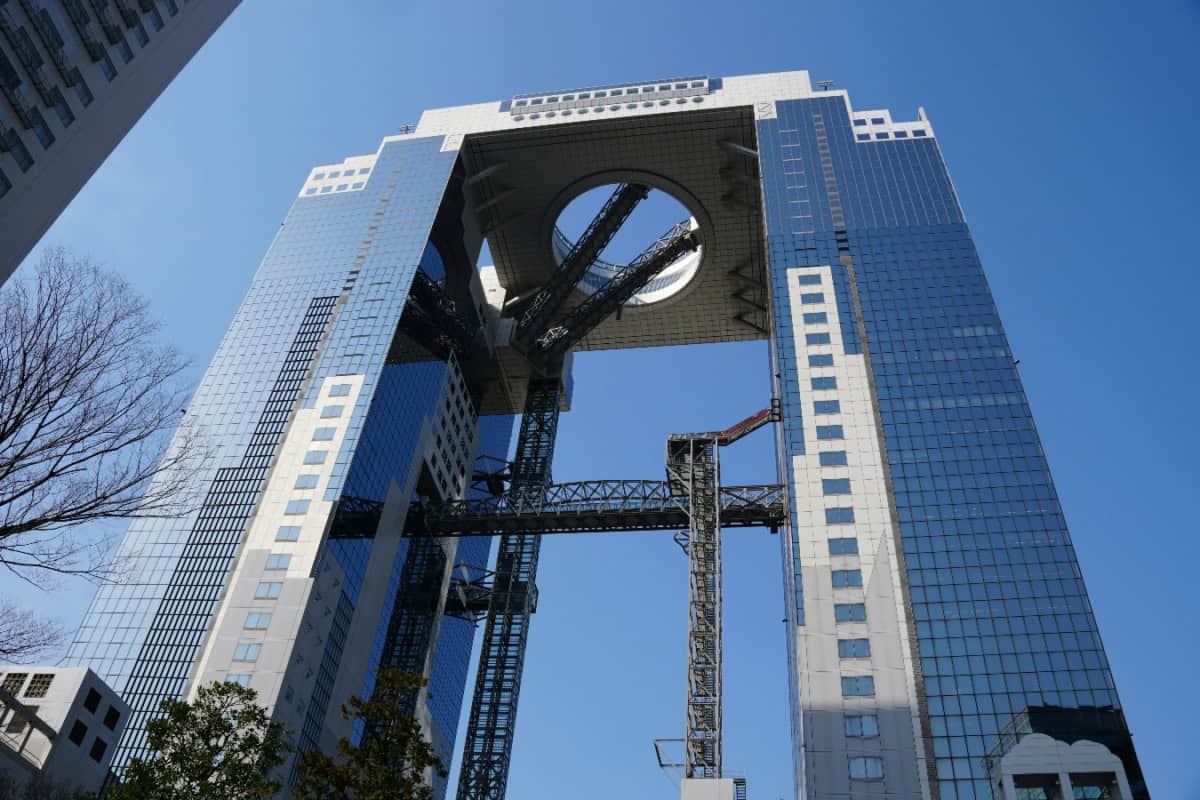 looking up at umeda sky building from the ground below it