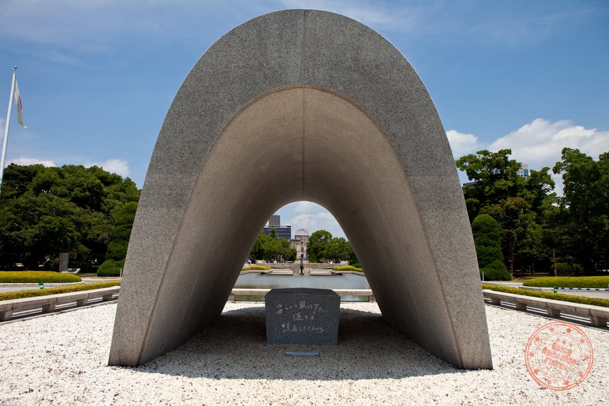 cenotaph for atomic bomb victims in front of pond of peace