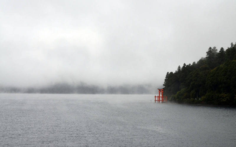 torri gate in water on foggy day