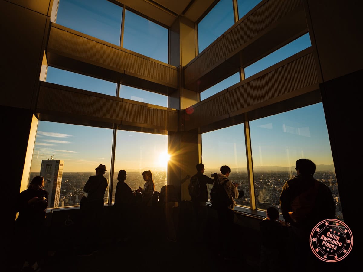 Where To Find The Best Observation Decks In Tokyo For Stunning Cityscapes people looking out an observation deck in tokyo
