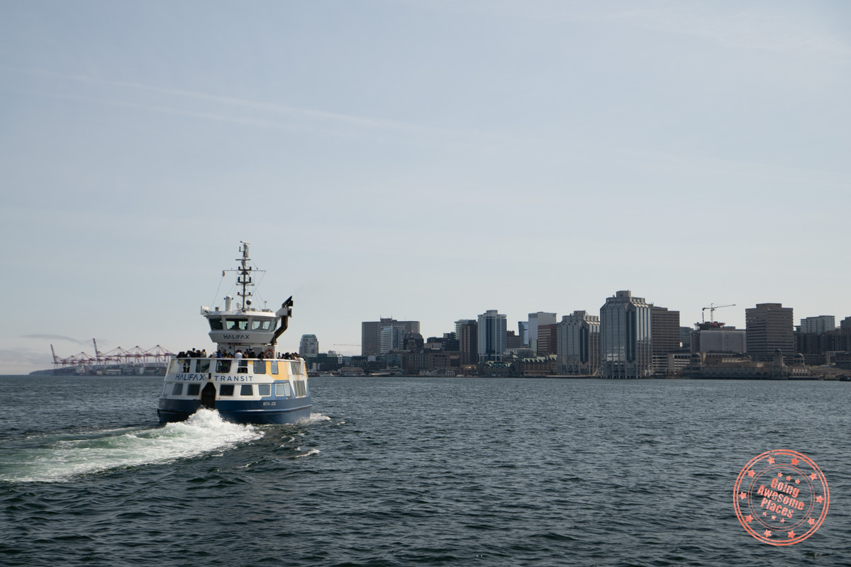 public ferry heading back towards halifax with cityline in view
