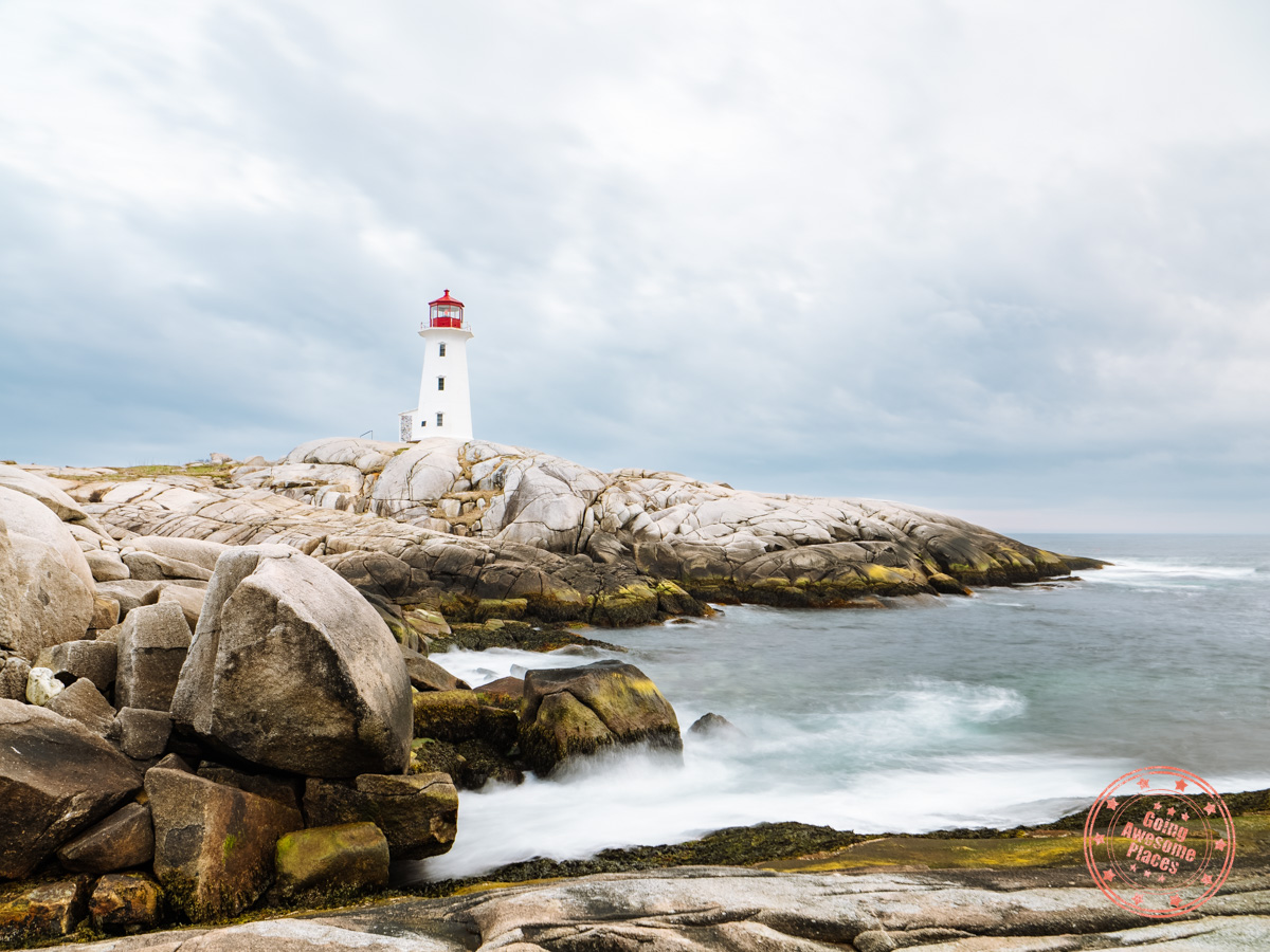 peggys cove long exposure of crashing waves at sunset