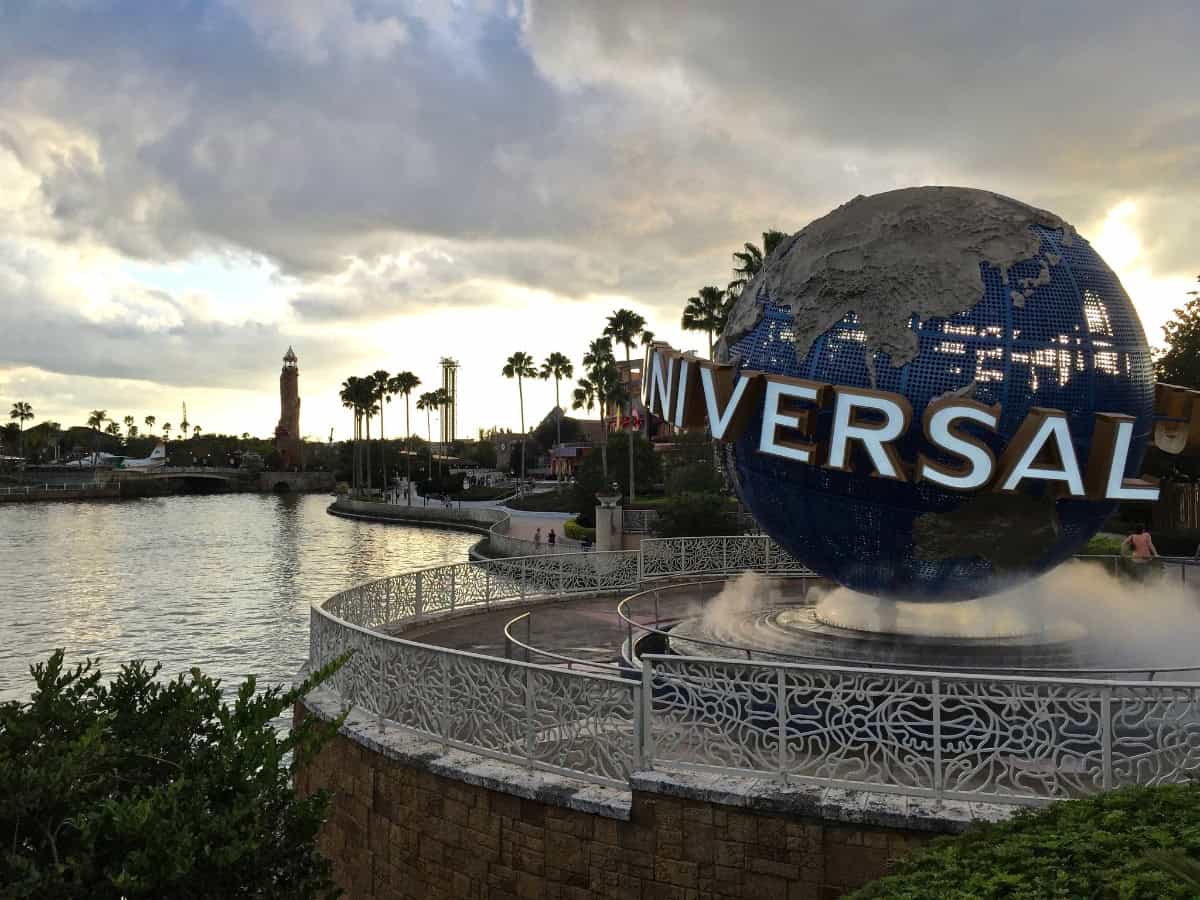 famous universal studios globe sign sitting on lake
