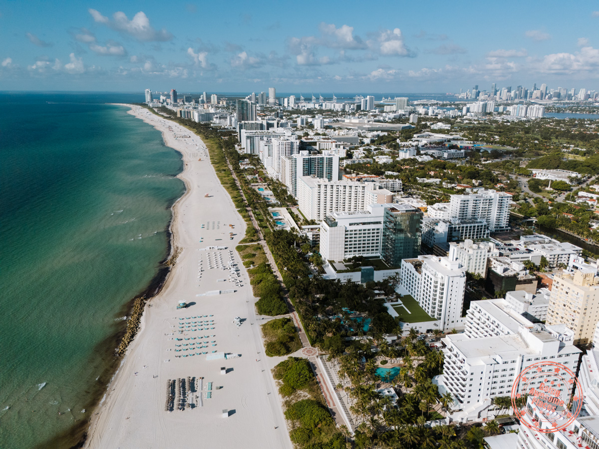 aerial of palmos hotel and spa framed in mid miami beach