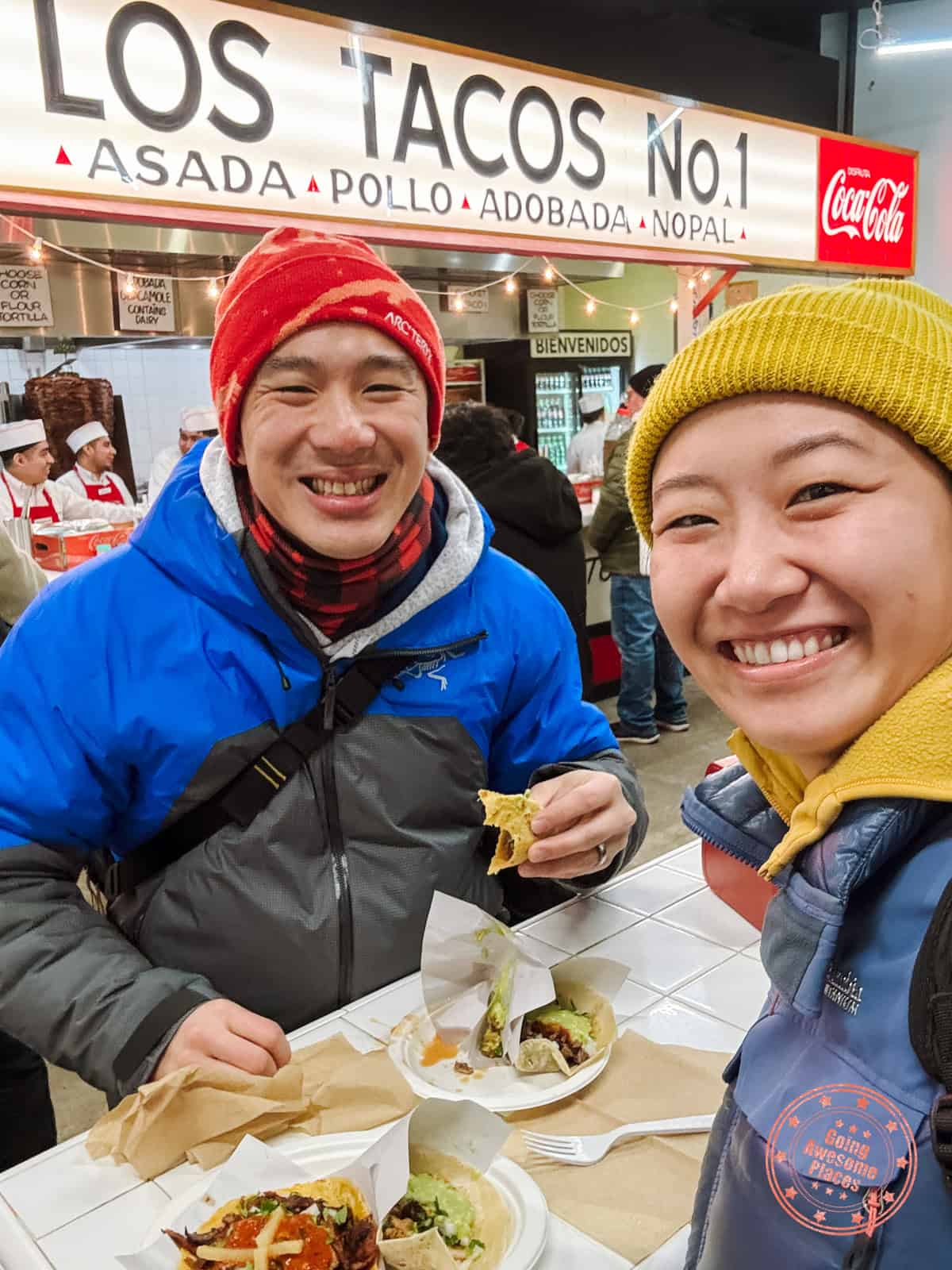 asian couple enjoying los tacos in nyc