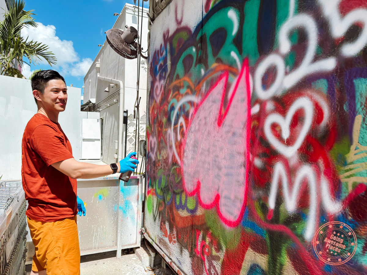 man creating graffiti in street art experience spray freestyle